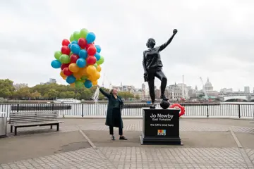 Jo Newby Holds 90 Coloured Balloons Representing The Children She's Fostered (Resize)