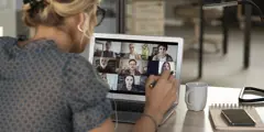 Premium Getty Image Woman In Blue Blouse On Video Call Meeting