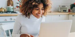 Young Girl Smiling On Laptop